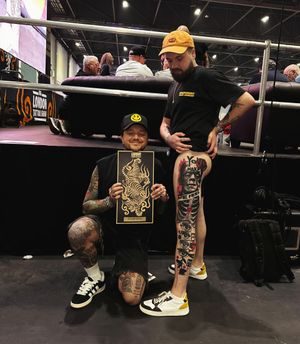 Simon with an award at a tattoo convention